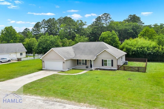 29 Joy Ln, Midway, GA 31320 - ranch-style house featuring an attached garage, concrete driveway, central AC unit, covered porch, and roof with shingles