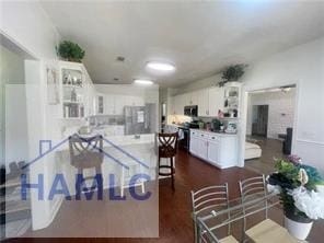 485 Cody Dr, Jesup, GA 31545 - dining space featuring dark wood-style floors