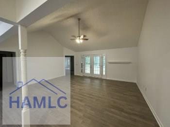 additional living space with vaulted ceiling, ceiling fan, and wood finished floors