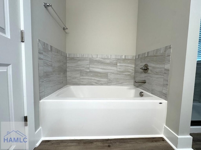 193W Melody Dr, Jesup, GA 31545 - bathroom featuring a bath and wood finished floors