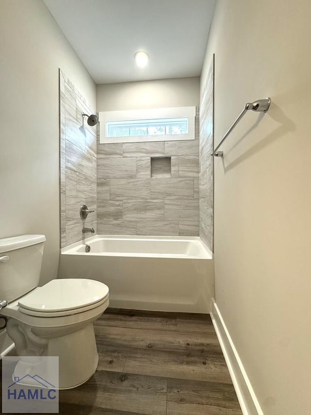 193W Melody Dr, Jesup, GA 31545 - bathroom featuring shower / bathtub combination and wood finished floors