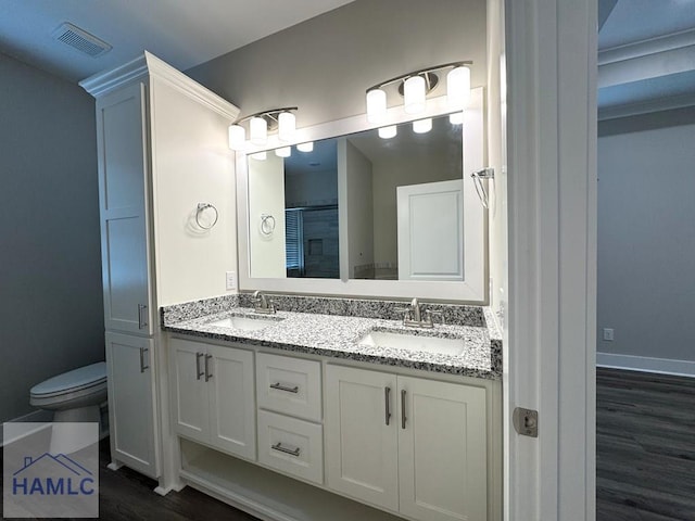 193W Melody Dr, Jesup, GA 31545 - full bathroom featuring double vanity and wood finished floors