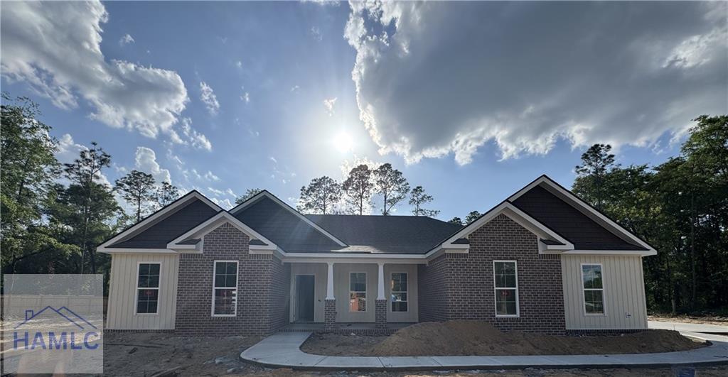193W Melody Dr, Jesup, GA 31545 - view of front of house with brick siding, fence, and covered porch