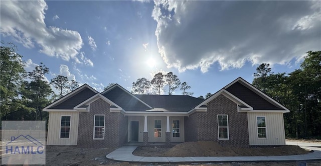 193W Melody Dr, Jesup, GA 31545 - view of front of house with brick siding, fence, and covered porch