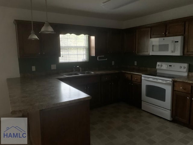 kitchen with pendant lighting, kitchen peninsula, white appliances, and sink