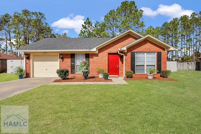 ranch-style home with a garage, brick siding, fence, driveway, and a front yard