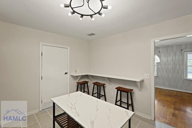 265 Mahan St, Jesup, GA 31545 - dining space featuring baseboards and a chandelier