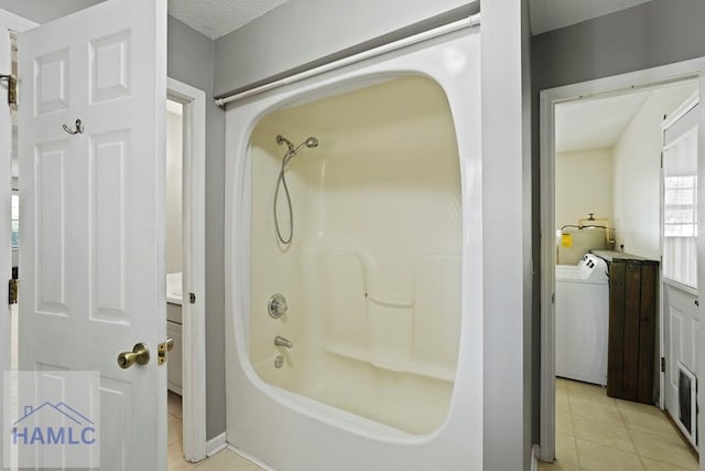 265 Mahan St, Jesup, GA 31545 - bathroom featuring tile patterned floors, washer / clothes dryer, bathing tub / shower combination, a textured ceiling, and vanity