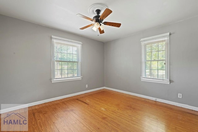 265 Mahan St, Jesup, GA 31545 - unfurnished room featuring wood finished floors and a ceiling fan