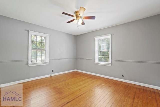 265 Mahan St, Jesup, GA 31545 - empty room with plenty of natural light, hardwood / wood-style flooring, and ceiling fan
