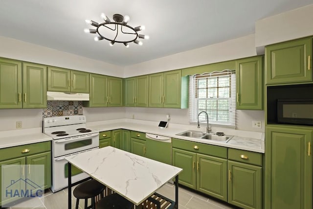 265 Mahan St, Jesup, GA 31545 - kitchen with under cabinet range hood, white appliances, light countertops, light tile patterned floors, and tasteful backsplash