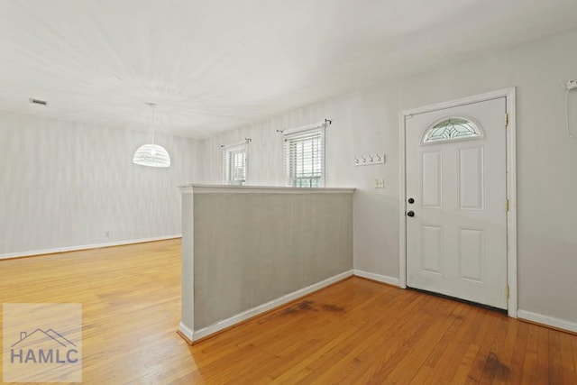 265 Mahan St, Jesup, GA 31545 - foyer entrance featuring light wood-style floors and baseboards