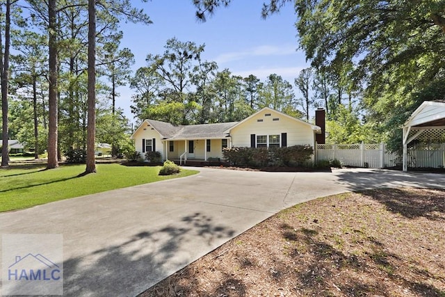265 Mahan St, Jesup, GA 31545 - view of front of property with driveway, a chimney, and a porch