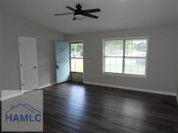 1111 Apache Aly, Hinesville, GA 31313 - spare room with lofted ceiling, a ceiling fan, and wood finished floors