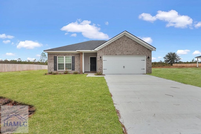 view of front of house with a garage and a front lawn