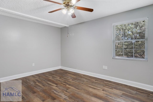 spare room featuring ceiling fan, baseboards, a textured ceiling, and wood finished floors