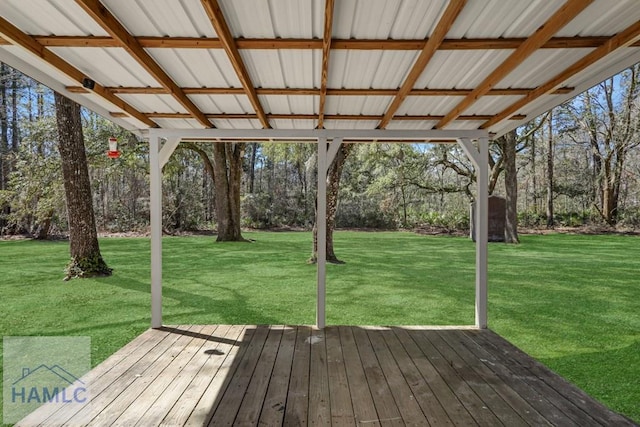 wooden deck featuring a yard