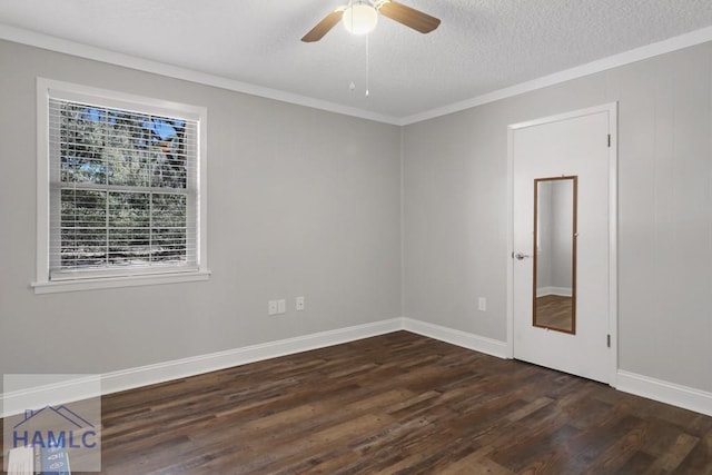 empty room with a ceiling fan, crown molding, dark wood-style floors, and a textured ceiling