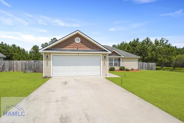 138 Forest St NE, Ludowici, GA 31316 - view of front facade featuring concrete driveway and a garage