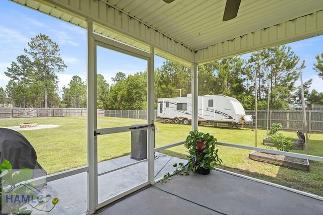 138 Forest St NE, Ludowici, GA 31316 - unfurnished sunroom featuring ceiling fan and view of wooded area