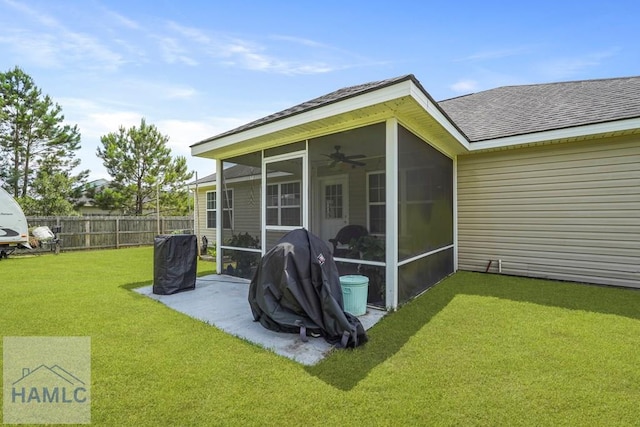 138 Forest St NE, Ludowici, GA 31316 - rear view of property with a sunroom, roof with shingles, and a ceiling fan