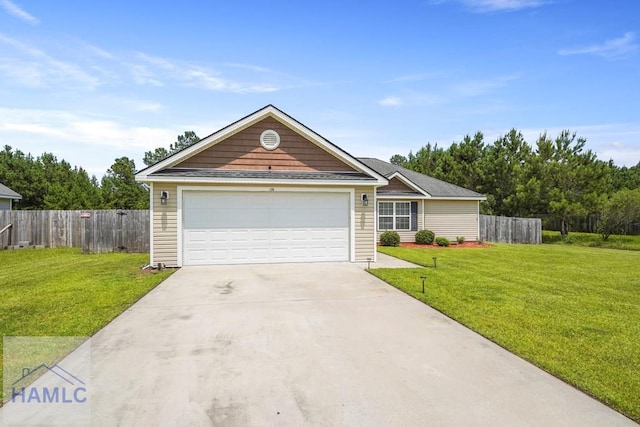138 Forest St NE, Ludowici, GA 31316 - view of front facade featuring driveway and a garage