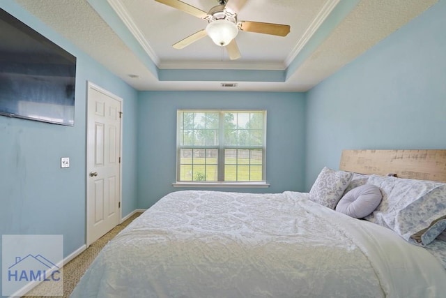 138 Forest St NE, Ludowici, GA 31316 - bedroom with a raised ceiling, ornamental molding, carpet, and a ceiling fan