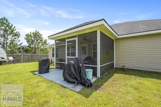 138 Forest St NE, Ludowici, GA 31316 - back of property with a sunroom, roof with shingles, and ceiling fan