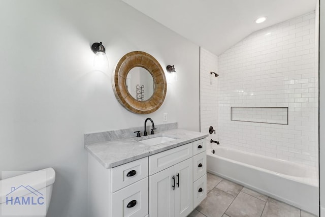 full bath with vanity, tile patterned floors, toilet, shower / washtub combination, and lofted ceiling