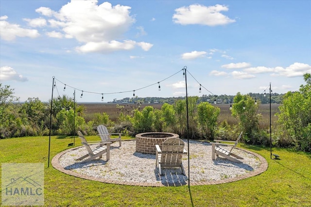 view of yard featuring an outdoor fire pit