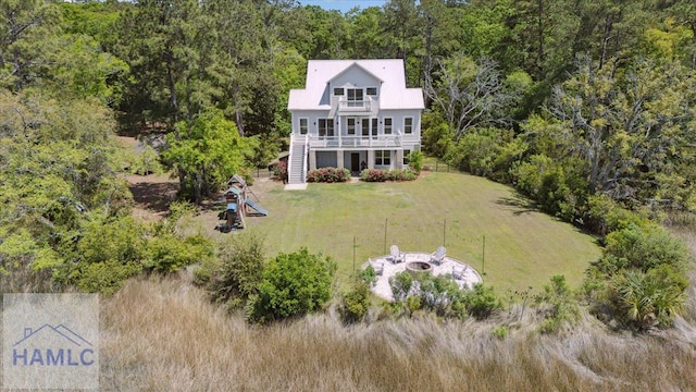 bird's eye view with a wooded view