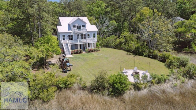 drone / aerial view with a view of trees