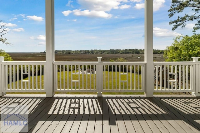 wooden deck featuring a yard