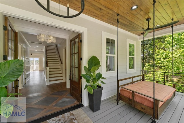 exterior space featuring a ceiling fan