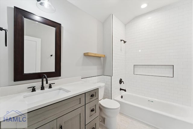 bathroom featuring recessed lighting, toilet, tub / shower combination, and vanity