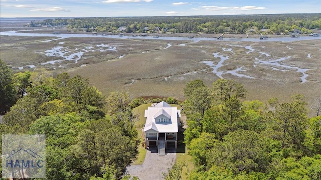 bird's eye view featuring a water view and a forest view
