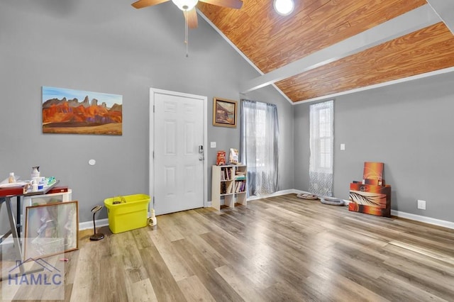 miscellaneous room featuring lofted ceiling with beams, light hardwood / wood-style floors, wooden ceiling, and ceiling fan