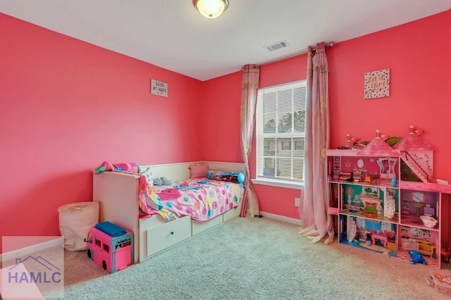 carpeted bedroom with visible vents and baseboards