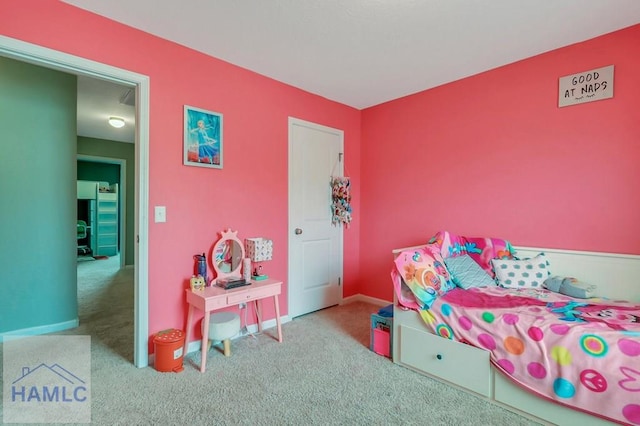 bedroom with carpet and baseboards