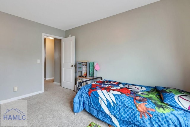 bedroom with carpet and baseboards