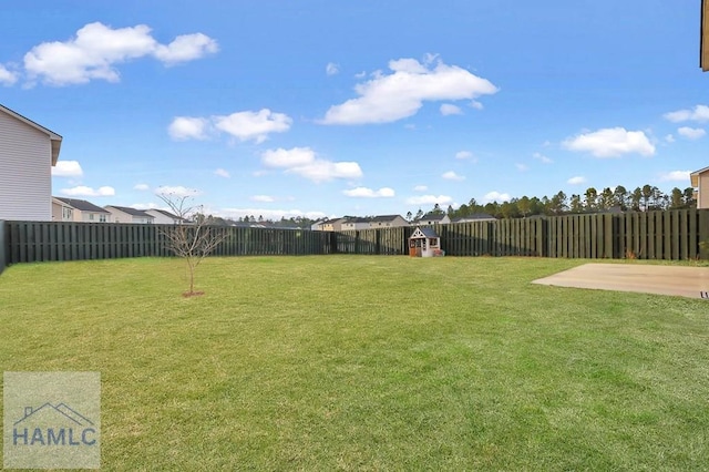 view of yard with a patio and a fenced backyard