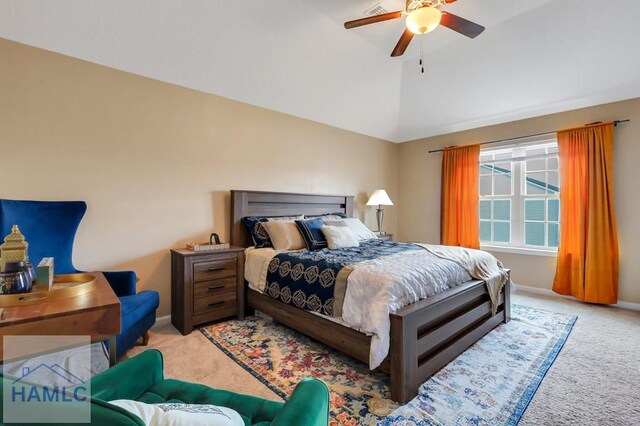 carpeted bedroom with vaulted ceiling, baseboards, and ceiling fan