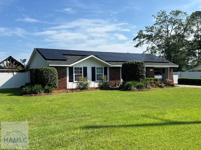 3520 Waycross Hwy, Jesup, GA 31545 - single story home featuring brick siding, roof mounted solar panels, board and batten siding, and a shingled roof