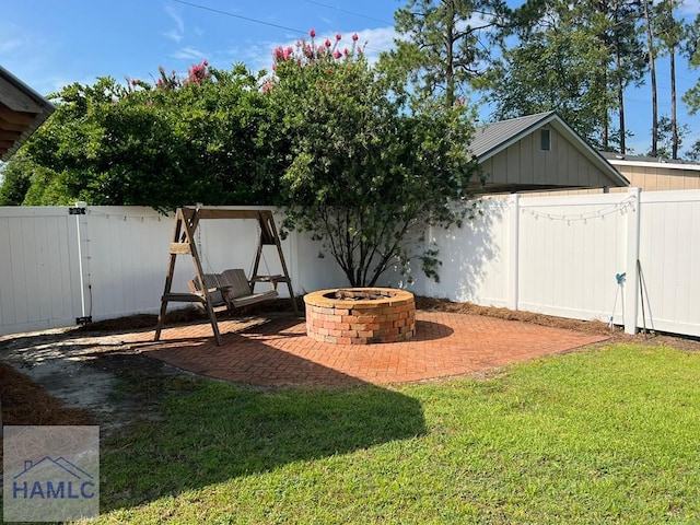 3520 Waycross Hwy, Jesup, GA 31545 - fenced backyard featuring an outdoor fire pit and a patio