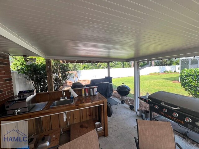 3520 Waycross Hwy, Jesup, GA 31545 - fenced backyard featuring a patio and a grill