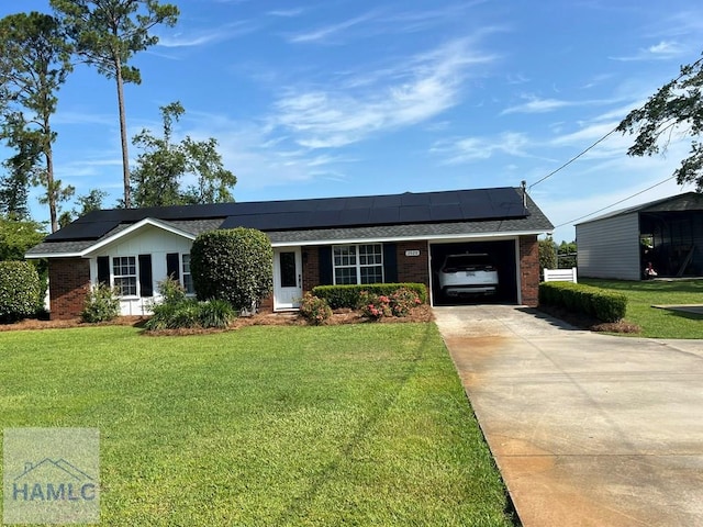 3520 Waycross Hwy, Jesup, GA 31545 - ranch-style house with a garage, brick siding, a front yard, concrete driveway, and solar panels
