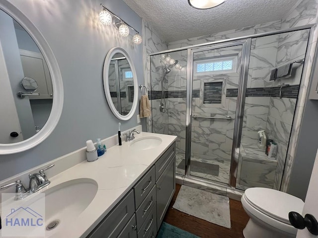 3520 Waycross Hwy, Jesup, GA 31545 - bathroom with double vanity, a textured ceiling, and a marble finish shower