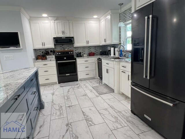 3520 Waycross Hwy, Jesup, GA 31545 - kitchen with black appliances, white cabinetry, light stone countertops, tasteful backsplash, and recessed lighting
