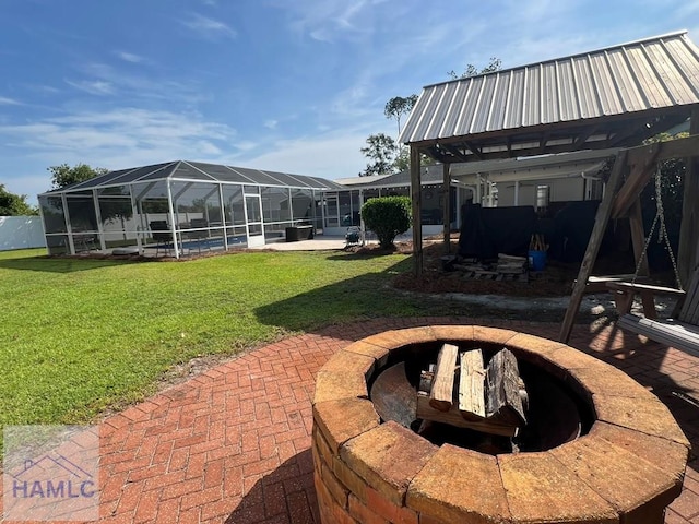 3520 Waycross Hwy, Jesup, GA 31545 - view of grassy yard featuring a fire pit, glass enclosure, a pool, and a patio area