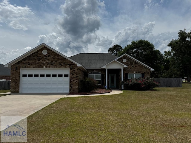 craftsman-style house featuring fence, a front lawn, brick siding, a garage, and concrete driveway